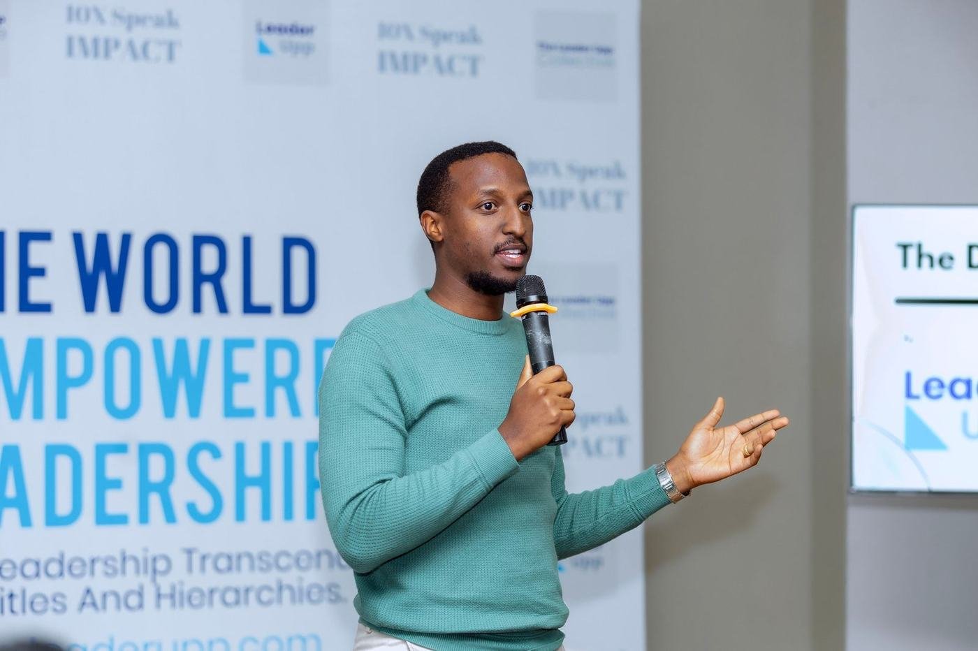 Kizito Nyuytiymbiy speaking at a Leader Upp event in Kigali
